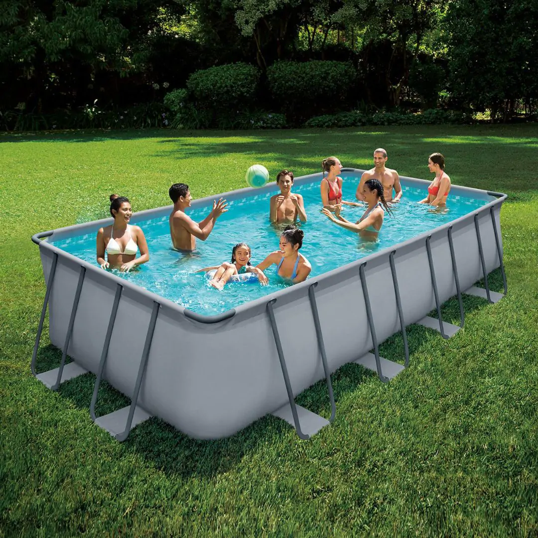Above-ground pool with swimmers in a Westchester County backyard